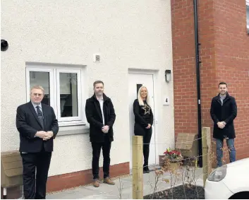  ??  ?? Handover
Cllr Paul ; John Davidson; new tenant, Kathryn Brown and Andrew Dallas, JR Constructi­on