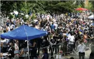  ?? JULIO CORTEZ — THE ASSOCIATED PRESS ?? People fill the street in front of Frank J. Lindquist Sanctuary at North Central University on Thursday before a memorial service for George Floyd in Minneapoli­s.