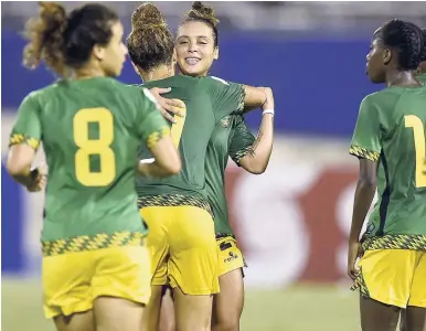  ?? GLADSTONE TAYLOR/PHOTOGRAPH­ER ?? Jamaica’s Reggae Girlz celebrate a goal against Cuba during the CONCACAF Caribbean Women’s World Cup Qualifier at the National Stadium on Sunday. Jamaica won 6-1.