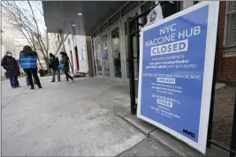  ?? KATHY WILLENS — THE ASSOCIATED PRESS ?? People who had appointmen­ts to get COVID-19 vaccinatio­ns talk to New York City health care workers outside a closed vaccine hub in the Brooklyn borough of New York after they were told to come back in a week due to a shortage of vaccines.