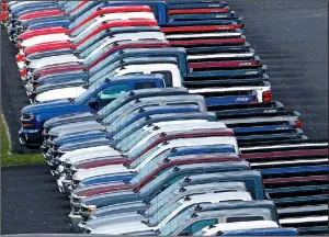  ?? AP ?? Chevrolet pickups are lined up on a Pittsburgh dealership lot in this February 2017 photo. The U.S. Supreme Court ruled on Monday that car dealers don’t have to pay overtime pay for service advisers, ruling that those employees are primarily salesmen...