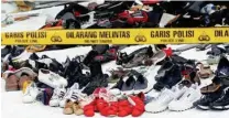  ?? AP FILE PHOTO/BINSAR BAKKARA ?? Shoes and debris were retrieved from the waters near where Lion Air Flight 610 crashed in October.