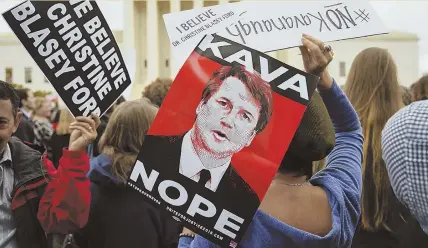  ?? AP PHOTO ?? ‘KAVA NOPE’: Protesters gather in front of the Supreme Court in Washington, D.C., yesterday, holding signs with the image of Judge Brett Kavanaugh.