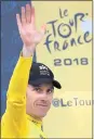  ?? CHRISTOPHE ENA — AP ?? British rider Geraint Thomas celebrates on the podium after Sunday’s 15th stage.