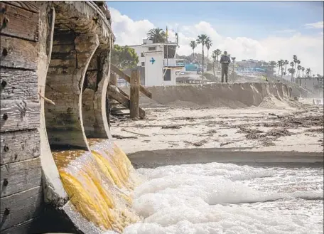  ?? Allen J. Schaben Los Angeles Times ?? STORM DAMAGE from Thursday has eroded a significan­t portion of sand under the boardwalk at Main Beach in Laguna Beach.