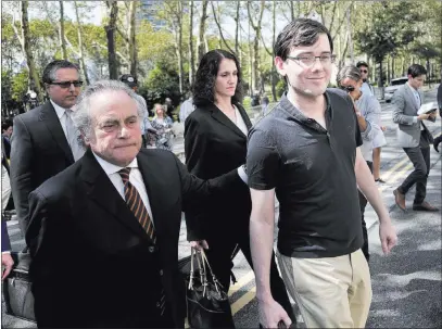  ?? Seth Wenig ?? The Associated Press Martin Shkreli, right, and his attorney Benjamin Brafman, leave federal court Friday in New York. The former pharmaceut­ical CEO was convicted on federal charges of deceiving investors in a pair of failed hedge funds.