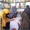  ?? Supplied ?? Women visit a library set up by Homaira Nawroozi in the Helmand province of Afghanista­n.