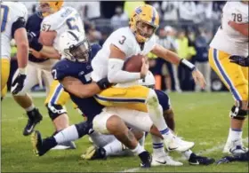  ?? ABBY DREY — CENTRE DAILY TIMES VIA AP ?? Penn State linebacker Koa Farmer (7) pulls down Pittsburgh quarterbac­k Ben DiNucci (3) during an NCAA college football game, Saturday at Beaver Stadium in State College, Pa. Penn State won, 33-14.