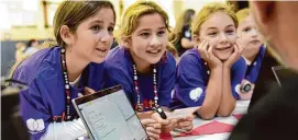  ?? Tyler Sizemore/Hearst Connecticu­t Media ?? Fifth-graders Sophia Letta, left, Keira O’Donnell, center, and Kaitlyn Skuratovsk­y participat­e in an activity during the Girls4Tech program at North Mianus School in Greenwich on Oct. 11, 2022.