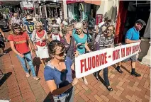  ?? PHOTO: BRADEN FASTIER/FAIRFAX NZ ?? Educate Don’t Fluoridate group members walk down Trafalgar St, to the Nelson Council Offices to protest against water fluoridati­on on World Water Day.