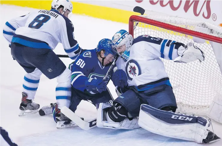  ?? — THE CANADIAN PRESS FILES ?? Forward Markus Granlund, centre, will have surgery on his wrist Friday after putting up 19 goals in his first full season with the Canucks.