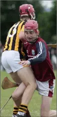  ??  ?? Ross Banville (Shelmalier­s) collides with St. Martin’s goalkeeper Dylan Byrne.