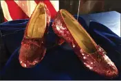  ?? JEFF BAENEN — THE ASSOCIATED PRESS FILE ?? Ruby slippers once worn by Judy Garland in the “The Wizard of Oz” are displayed at a news conference on Sept. 4, 2018, at the FBI office in Brooklyn Center, Minn.