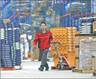  ?? REUTERS ?? An employee works at a JD.com logistics center in Langfang, Hebei province.