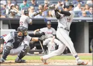  ?? Bill Kostroun / Associated Press ?? Victor Reyes of the Tigers hits an RBI double during the fourth inning of Sunday’s game against the Yankees at Yankee Stadium in New York.