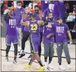  ?? MARK J. TERRILL— THE ASSOCIATED PRESS ?? The Lakers’ LeBron James (23) celebrates with teammates during a timeout in the final moments of an NBA conference final playoff game against the Denver Nuggets Saturday, in Lake Buena Vista, Fla.