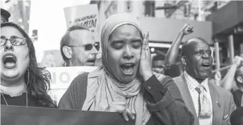  ?? AGENCE FRANCE PRESSE ?? Protesters hold a rally outside of Manhattan Federal Court in New York City.