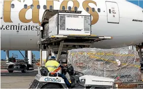  ?? GETTY IMAGES ?? A container holding an early shipment of the AstraZenec­a Covid-19 vaccine is unloaded at Sydney Internatio­nal airport on February 28.