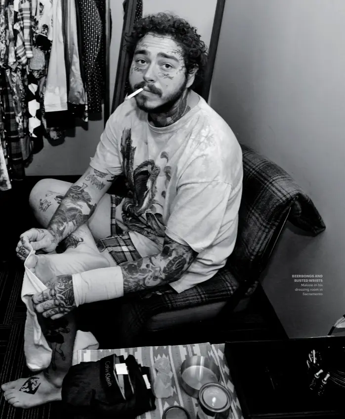  ??  ?? BEERBONGS AND BUSTED WRISTS
Malone in his dressing room in
Sacramento