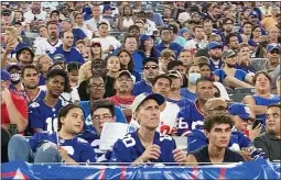  ?? TOM CANAVAN — THE ASSOCIATED PRESS ?? Fans attend the New
York Giants’ NFL football practice at MetLife Stadium on Wednesday, Aug. 11, 2021, in East Rutherford, N.J.