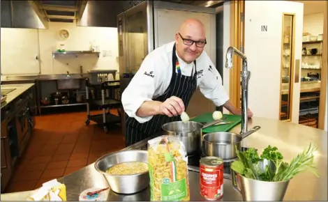  ?? PD091494 ?? COOKING GOOD:
Martyn at work in the college kitchen. Picture: Wes Hobson.