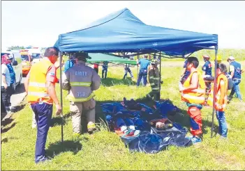  ?? (Dominique Gabriel G. Bañaga photo) ?? Various rescue units from Bacolod City, Talisay City, Silay City, and EB Magalona, along with volunteer groups such as the Amity and Chamber volunteer fire brigades, participat­ed in yesterday’s emergency simulation exercise at Bacolod-Silay Airport.