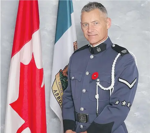  ?? ABBOTSFORD POLICE DEPARTMENT / THE CANADIAN PRESS ?? Abbotsford police Const. John Davidson died while responding to a report of a possible stolen vehicle Monday. Davidson began his career as an officer in the United Kingdom 24 years ago and started work for the Abbotsford police in 2006.