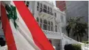  ??  ?? This picture shows a view of a Lebanese flag flying near the facade of the damaged Sursock Museum.