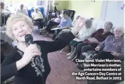  ??  ?? Close bond: Violet Morrison, Van Morrison’s mother, entertains members of the Age Concern Day Centre at
North Road, Belfast in 2003