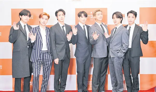  ?? ?? BTS members (From left) V, Suga, Jin, Jungkook, RM, Jimin and J-Hope pose for pictures at the global conference conducted Sunday at SoFi Stadium in Los Angeles.