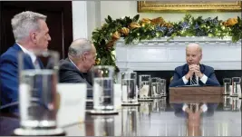  ?? ANDREW HARNIK — THE ASSOCIATED PRESS FILE ?? President Joe Biden, right, meets with congressio­nal leaders to discuss legislativ­e priorities on Nov. 29 in the Roosevelt Room of the White House in Washington. From left are House Minority Leader Kevin McCarthy of Calif., and Senate Majority Leader Chuck Schumer, of N.Y.