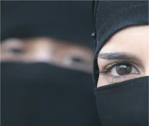 ?? PETER MACDIARMID / GETTY IMAGES FILES ?? Whether Muslim women cover their hair and dress modestly is often dictated by tradition, writes Lise Ravary.