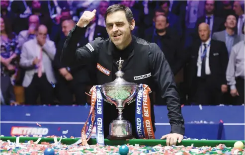  ?? Picture: Getty Images ?? ALL SMILES. England’s Ronnie O’Sullivan poses with the World Snooker Championsh­ip trophy after beating countryman Judd Trump in the final at the Crucible Theatre in Sheffield on Monday night.