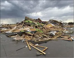  ?? MARGERY A. BECK — THE ASSOCIATED PRESS ?? Debris is seen from a destroyed home northwest of Omaha, Neb., after a storm tore through the area Friday.