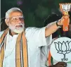  ?? AFP ?? Narendra Modi holds his BJP party’s symbol during a road show in Chennai on Tuesday.