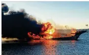  ?? PASCO COUNTY FIRE RESCUE VIA AP ?? Fire engulfs a boat that had been ferrying patrons Sunday afternoon to a casino ship off Florida’s Gulf Coast near Tampa. Dozens jumped overboard and made it safely to
land. One woman died later.
