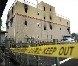  ?? JAE C. HONG — THE ASSOCIATED PRESS ?? The Kyoto Animation Studio building was consumed in an arson attack Thursday in Kyoto, Japan. The 41-year-old man suspected of setting the blaze has a criminal record.