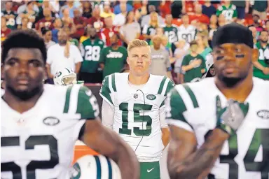  ?? ALEX BRANDON/ASSOCIATED PRESS ?? New York Jets quarterbac­k Josh McCown (15), seen here during the national anthem on Thursday, is No. 1 on the depth chart. But he knows that Sam Darnold is the future for the franchise.