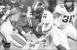  ?? Jim Cowsert Associated Press ?? RUNNING BACK Braeden West of Southern Methodist is taken down by Texas Christian’s Ridwan Issahaku during the first quarter Friday night.