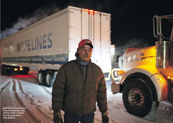  ??  ?? Ken Husband, a trucker from Strathmore, Alta., arrives with a convoy at a meeting point near Regina.