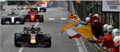  ??  ?? above Race winner Daniel Ricciardo, driving the Aston Martin Red Bull Racing RB14 TAG Heuer, is greeted by €ag waving marshals during the Monaco Grand Prix. right Daniel Ricciardo celebrates his win on the podium with a shoey.