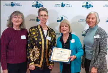  ?? ?? Members of the Kutztown Community Library stand with Charlotte Hoare, second from right, winner of the Outstandin­g Library Staff Member Award.