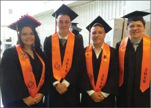  ??  ?? At right, graduates Samantha Dumais, Michael Lawrence, Austin Van Lingen and Connor Legg, from left, share a light-hearted moment before the procession­al.
Pictured below, Uxbridge High School Principal Michael Rubin leads the graduation procession...
