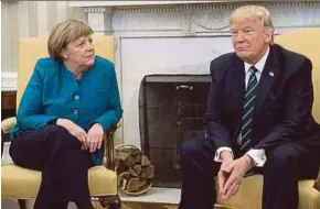  ?? AFP PIC ?? United States President Donald Trump and German Chancellor Angela Merkel in the Oval Office of the White House in Washington on Friday.