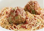  ??  ?? Huge meatballs on a bed of pasta with marinara sauce