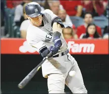  ?? (AP) ?? New York Yankees’ Aaron Judge hits a two-run home run during the eighth inning of a baseball game against the Los Angeles Angels on June 12, in
Anaheim, California.