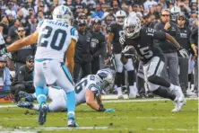  ?? Gabrielle Lurie / The Chronicle ?? Michael Crabtree (right) had 110 yards on eight catches, including two key plays on the Raiders’ winning drive.