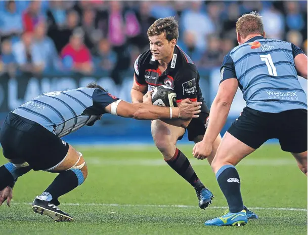  ?? Pictures: Getty. ?? Above: Chris Dean of Edinburgh is tackled by Rhys Gill of Cardiff Blues. Top right: John Hardie of Edinburgh fails to escape the attentions of Josh Navidi. Right: Cardiff’s Josh Turnbull is brought to ground by Junior Rasolea.