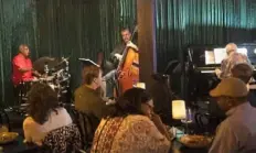  ?? Emily Matthews/Post-Gazette ?? Roger Humphries, left, Bob Insko and Frank Cunimondo play jazz while customers eat in September at Con Alma in Downtown.