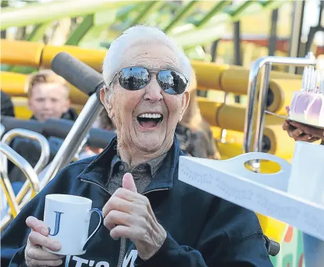  ??  ?? A MAN has celebrated his 105th birth- day by becoming the oldest person in the world to ride a rollercoas­ter.
Jack Reynolds said he was “amazed” by his first ride in 80 years.
He celebrated his milestone birthday on the Twistosaur­us attraction at...